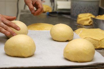 baker who works the paste in a french bakery
