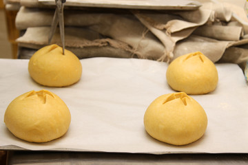 baker who works the paste in a french bakery