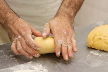 baker who works the paste in a french bakery