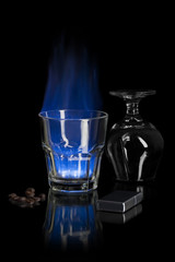 Flaming sambuca over black