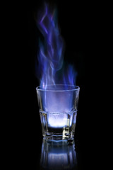 Flaming sambuca over black