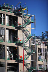 Zig Zag steps up the side of a refinery or industrial building