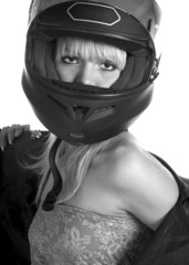 The beautiful girl with a motorcycle helmet