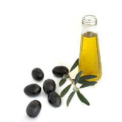 Bottle of olive oil and olive branch