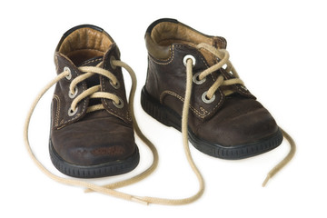 brown child shoe on white background