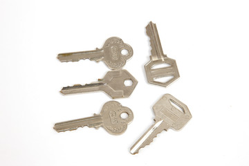 collection of metal keys on white background