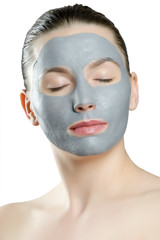 Close up of a woman with spa mask on her face