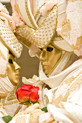 Two golden masks in Venice, Italy.