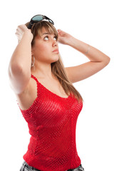 Portrait of teenage girl putting on sunglasses