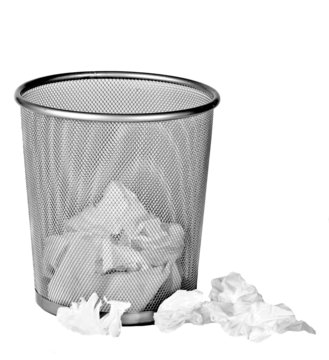 Wire metal bin with paper tissues on white background