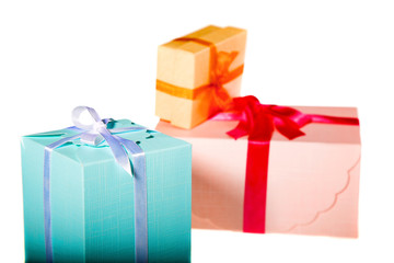 three colored gift boxes on the white