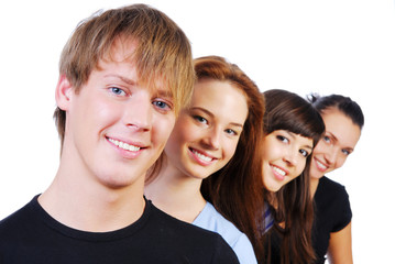 Row of  face of four young smiling teens on white