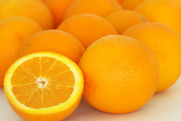 oranges with one cut in half