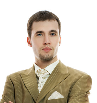 Handsome Young Groom In Wedding Suit Over White Background