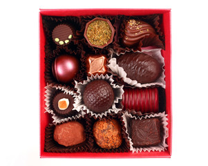 Chocolate candy group in red box on white
