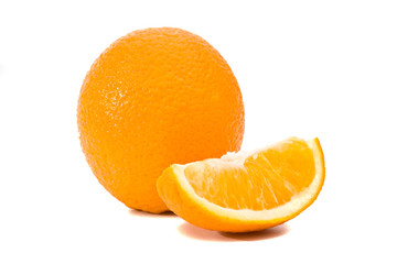 Whole and quartered oranges, isolated on white.