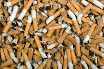 The background of used cigarette butts, texture
