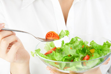 Close up of a plate with salad in hands