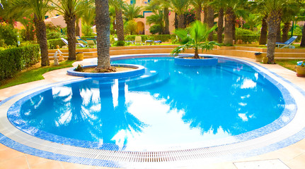 a blue pool on resort