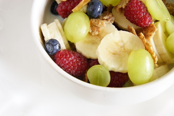 bowl of cereal with lots of  fresh fruit