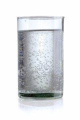 A vintage cylindrical glass hand made with water backlit