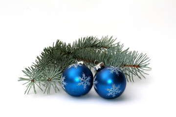 Fototapeta na wymiar Two balls and fir branch as Christmas decoration