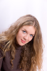 Naklejka premium Portrait of the young beautiful blonde with long hair