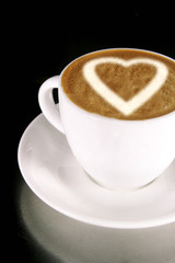 A heart on a creamy cup of cappucinno