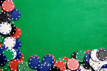 Casino chips on a green felt - background image