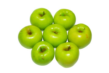 Stack of green apples isolated on white.