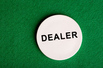 A dealer chip, part of a home poker game