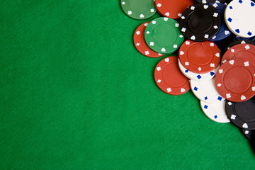 Casino chips on a green felt - background image