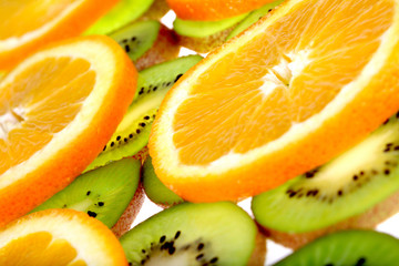 Fototapeta na wymiar orange and kiwi slices backgroundon white