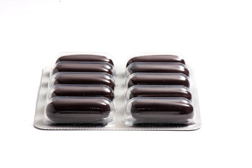 packs of vitamins on the white isolated background