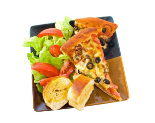 Pizza, salad and garlic bread over white