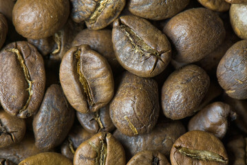 background from the spilled grains of Brazilian coffee
