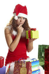 Attractive woman holding many gift boxes and bags.