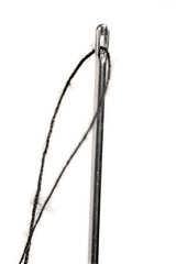 closeup of needle with thread