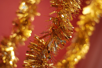 Bright Christmas golden garland on red background