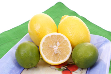 Obraz na płótnie Canvas citrus fruits on plate isolated on white background