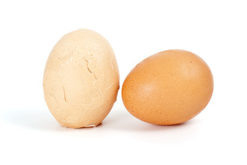 Whole and cracked eggs isolated on the white background