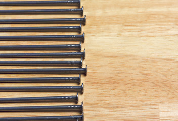 Fototapeta premium Macro of Nails on a Wood Background.