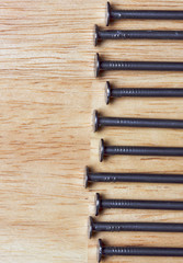 Macro of Nails on a Wood Background.