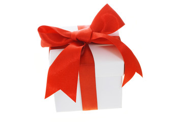 Gift box with red bow ribbon on white background
