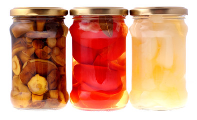 Glass jar of preserved peppers and mushroom