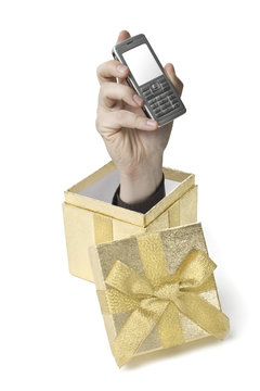 Eine Hand komt aus einer Geschenkebox heraus