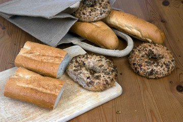 Bagels and French sticks on a kitchen table