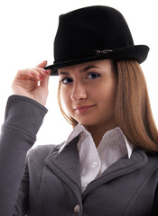Portrait of young female model in black hat