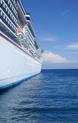 Cruise ship on a bright sunny day at sea.