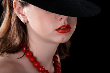 Portrait of pretty women in hat on black